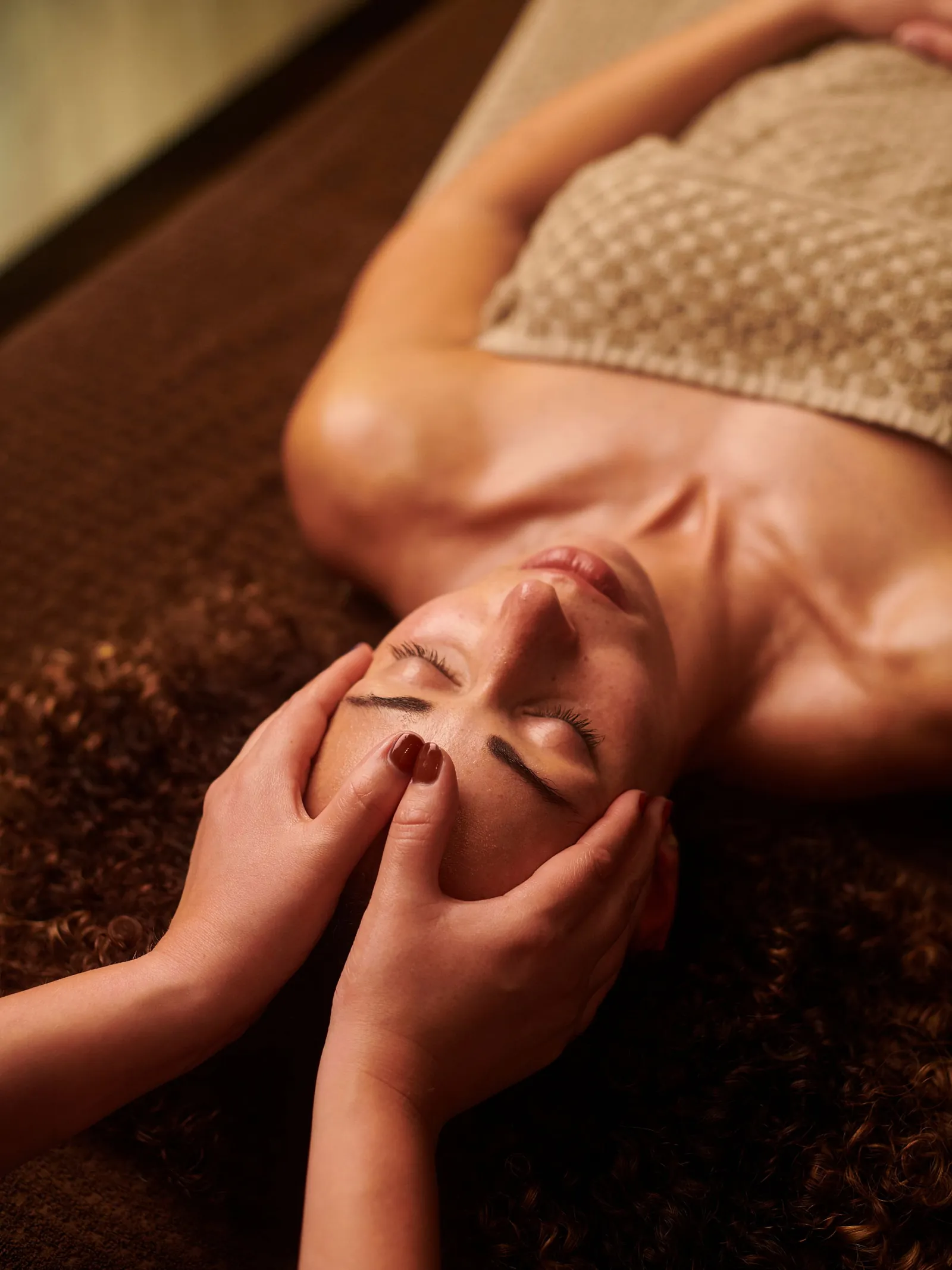 Essential oil massage underway in the wellness treatment room at Natural Shine Hair & Beauty